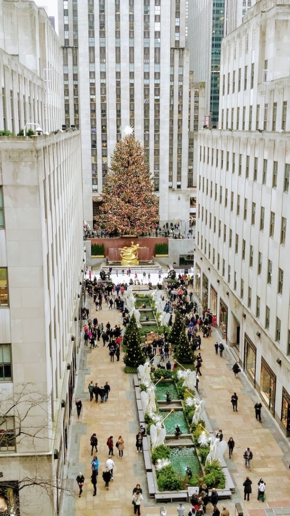 Rockefeller Center in New York with a view of the Christmas tree and ice rink.